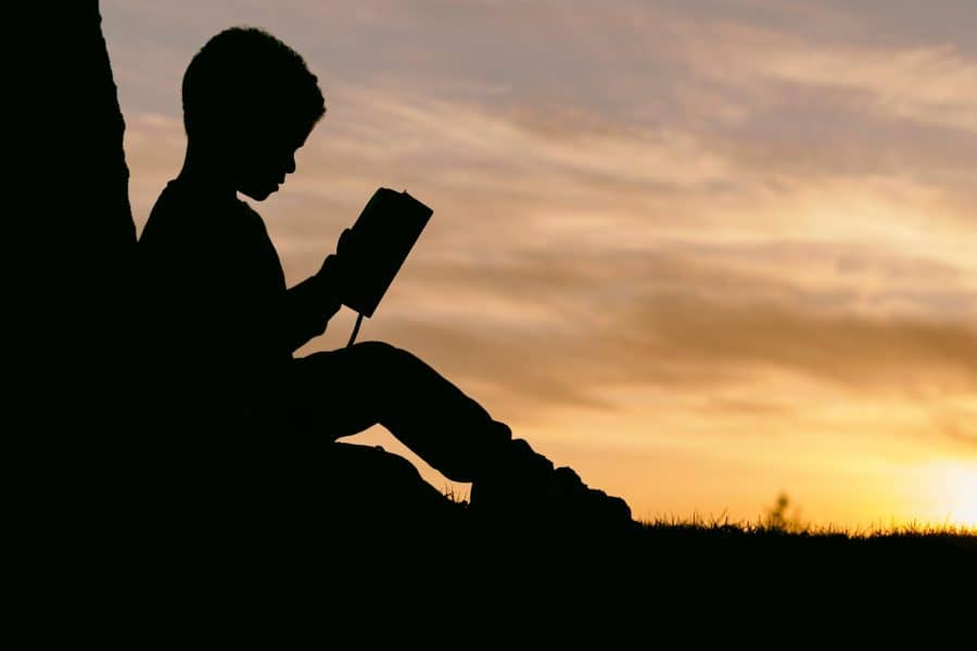 Little Boy reading a book